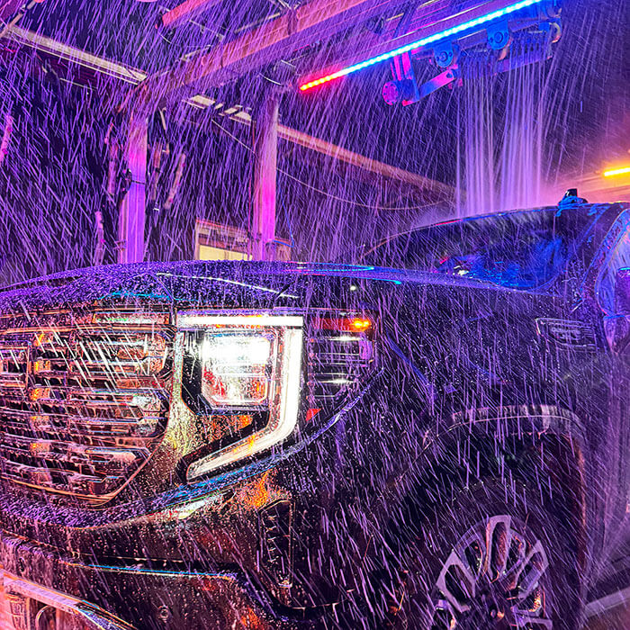 Close up of truck inside car wash tunnel